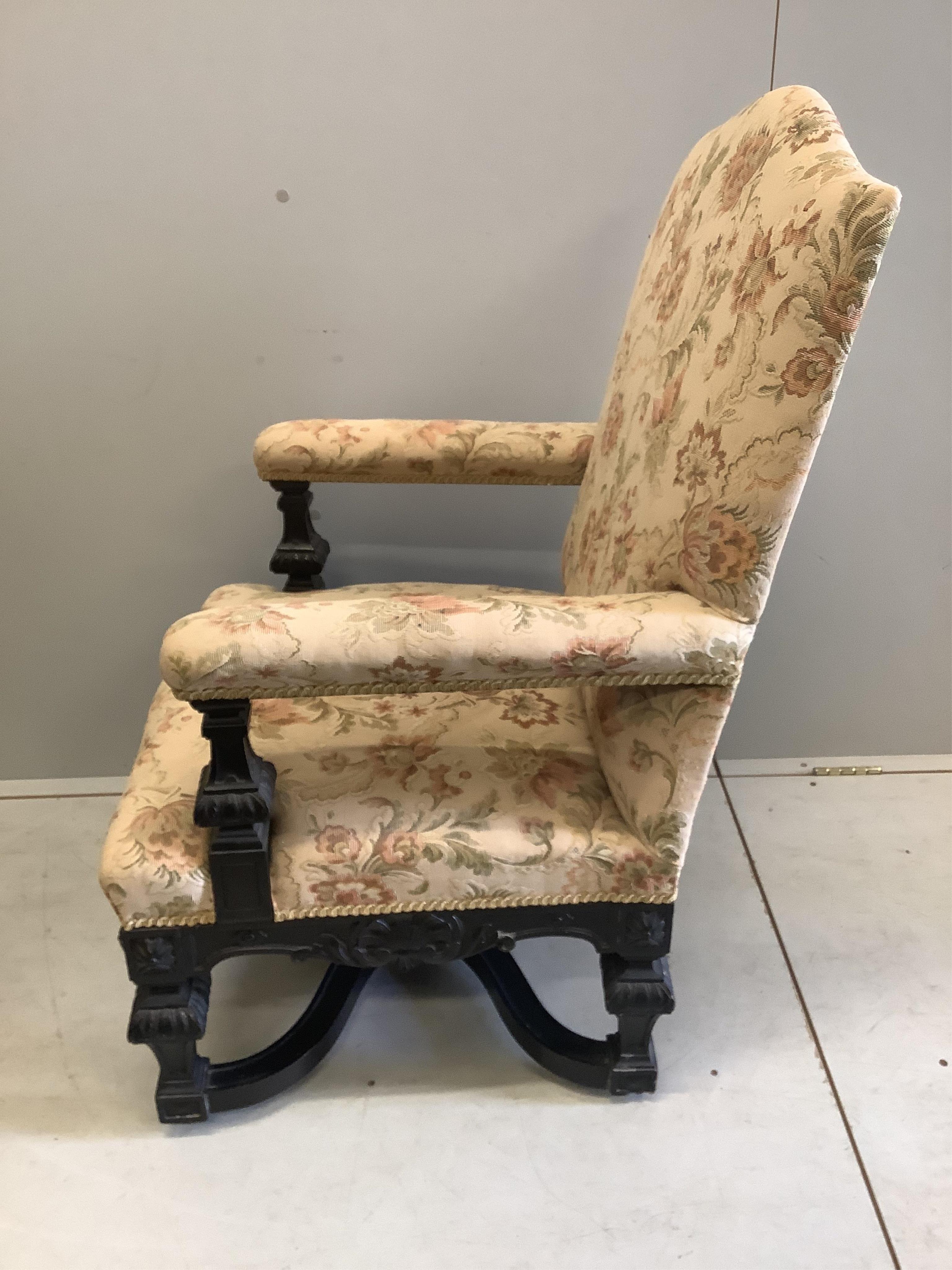 A pair of Louis XIV style ebonised upholstered armchairs, width 65cm, depth 56cm, height 103cm